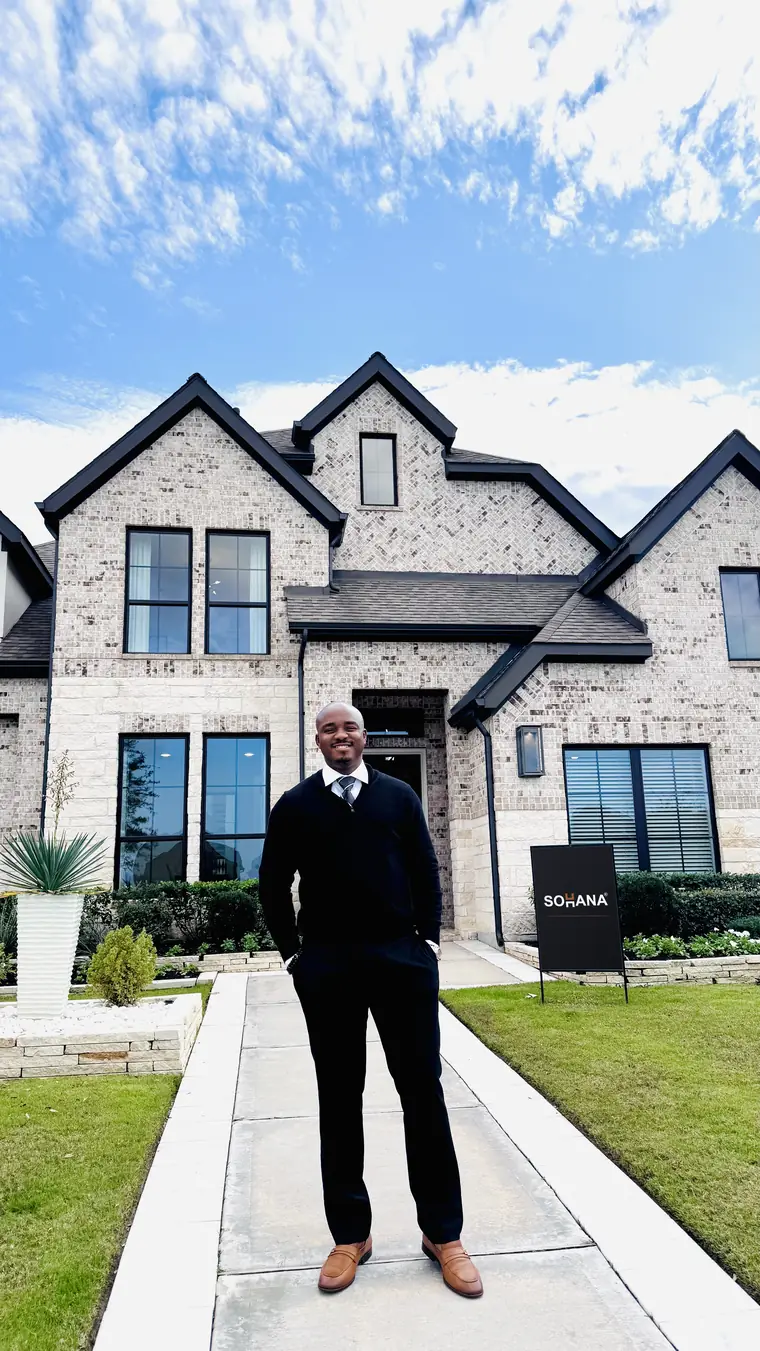 Henry S. Anaege outside a completed Sohana Homes residence
