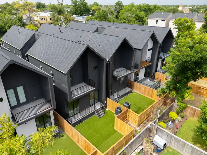Rear elevations with private balconies and turfed yards